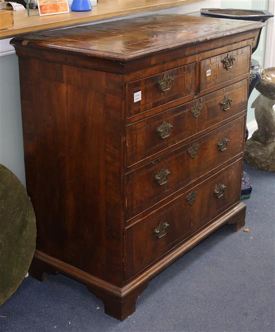 A George II walnut chest of five drawers W.102cm